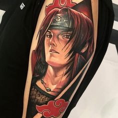 a woman's arm with an anime character tattoo on the left side of her body