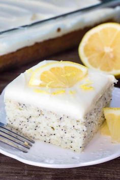 a slice of lemon cake on a plate with a fork