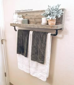 two towels are hanging on a towel rack