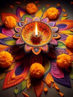 a colorful candle surrounded by flowers and petals