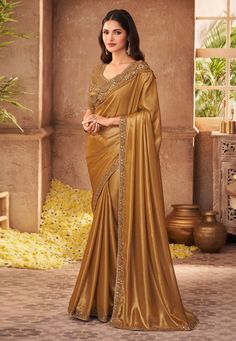 Golden silk saree with blouse 903  Desc:  Color : Golden Fabric : Silk Work : Sequins   Embroidery Wash Care : Dry clean Sleeve Style : Half Sleeve Long Sleeves : Done only in Custom Stitch Sleeves Lining : Done only in Custom Stitch Bust Size : 32 to 42 Inches Occasion : Wedding   Kitty Party   Mehendi   Sangeet   Party Wear   Engagement   Reception   Ceremonial. With Express Free Shipping and Custom Stitching, Buy Eid Special Saree Party wedding wear dresses Golden silk saree with blouse 903 o Shimmer Saree, Reception Saree, Party Wear Sarees Online, Party Sarees, Plain Saree, Satin Saree, Utsav Fashion, Party Kleidung, Brown Satin