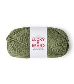 a ball of green yarn with the words lucky brand on it