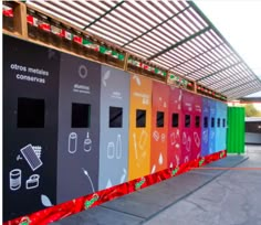 a row of colorful vending machines sitting next to each other