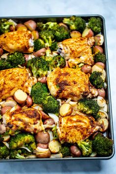 chicken, broccoli and potatoes in a baking pan