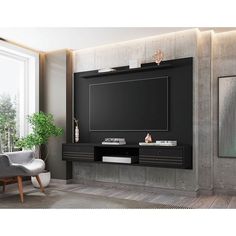 a living room with a large tv on the wall