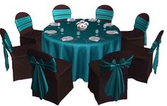 an image of a table set up for a wedding party with chairs and tables covered in teal cloths