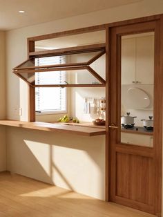 a kitchen with wooden shelves and white walls