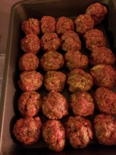 some meatballs are in a pan on the counter