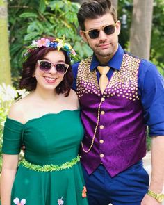 a man and woman dressed up in costume