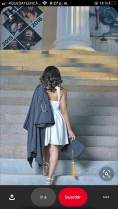 a woman in a white dress is sitting on the steps with her purse and coat over her shoulders