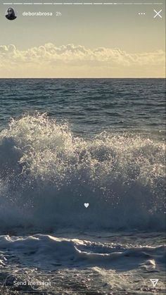 a man riding a wave on top of a surfboard in the ocean at sunset