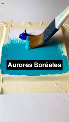 a paintbrush is sitting on top of a piece of paper with the words aurorares boreales