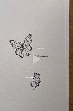 an open book with two butterflies on it