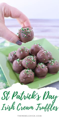 a green plate topped with chocolate covered truffles