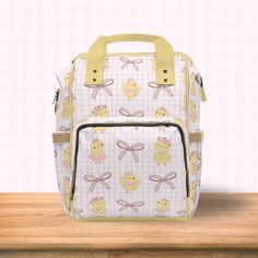 Introducing our Baby Chicks and pink Coquette ribbon bow print bag!  This versatile multi-purpose diaper bag is designed to simplify your life on the go with a touch of coquette aesthetic. Crafted with care from 100% high-grade nylon, this bag is both durable and stylish, making it a must-have for busy parents. With its spacious yet compact size of 15.0" × 10.8" × 6.7'', it strikes the perfect balance between functionality and convenience. Comfort is key, which is why we've equipped this bag wit Coquette Ribbon, Nappy Bags, Bags Game, Personalized Backpack, Bow Print, Pink Coquette, Checkerboard Pattern, Busy Parents, Baby Chicks