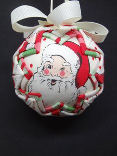 an ornament with a santa clause on it