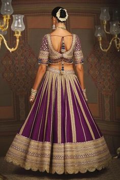 Dark purple toned attached cancan kalidar lehenga with wisteria vine striped gota, badla, dori intricate embroidery and heavy tassel ornamentations. Paired with a half sleeves flattering V neckline padded blouse with floral dori, gota jaal embroidery, dangling glass beads hem detail and heavy border embellished net dupatta. - Aza Fashions Designer Purple Lehenga With Motifs, Elegant Purple Lehenga With Dori Work, Purple Wedding Choli With Motifs, Purple Sharara With Motifs For Wedding, Purple Wedding Sharara With Motifs, Elegant Purple Lehenga With Motifs, Ceremonial Purple Sets With Traditional Drape, Purple Ceremonial Sets For Festivals, Wisteria Vine