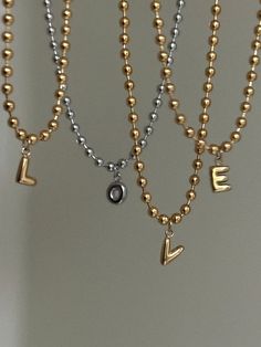 "Mini Bubble Letter Necklace ✨ Capital letter initial of your choice paired with a steel (18k gold plated) ball chain. Customizable length (if you need a length that isn't an option in the dropdown menu, please message me!) I'm also happy to make other customizations if necessary ✨☺️ Letter pendants are 1/4\" (.25\")  Unisex//Hypoallergenic~ tarnish proof and can be worn everyday!  Handmade with love" Gold Initial Necklace With Letter Beads For Anniversary, Gold Anniversary Letter Beads Necklace, Valentine's Day Gift Ball Chain Necklace, Gold Charm Necklace With Letter Beads For Anniversary, Gold Metal Jewelry With Letter Beads, Gold Charm Necklaces With Letter Beads, Personalized Gold Charm Necklaces With Letter Beads, Minimalist Gold Charm Necklaces With Letter Beads, Gold Minimalist Charm Necklace With Letter Beads