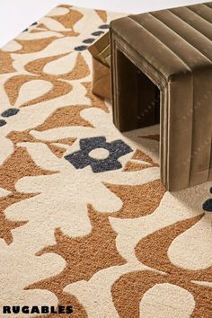 a dog house is on the floor next to a rug