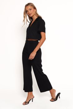 DETAILS  This matching top and pant set is designed for those who dare to redefine trends with a bold, modern twist. The cropped length top features a spread collar and a flattering V neckline, offering a fresh take on the classic crop. The high-waisted pants feature a cropped length that elongates your silhouette.    top and pant set  cropped length top   spread collar  v neckline  short sleeves  high waisted style pants  cropped length  belt loops  front fly zip with button closure  functional Matching Top And Pants Set, Outfit Wedding Guest, Top And Pants Set, High Waist Fashion, Flare Leg Pants, Style Pants, V Neckline, Matching Top, Pant Set