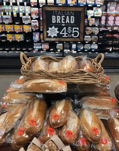 breads are on display in a grocery store for $ 5 95 per pound each