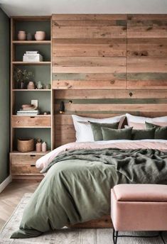 a large bed sitting next to a wooden headboard