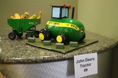 a john deere tractor is on display in a store's showroom,