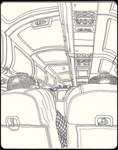 the inside of an airplane with two men sitting in seats and one man standing up