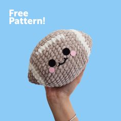 a hand holding up a stuffed animal with the words free pattern on it's face