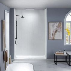 a bathroom with a large shower and white walls