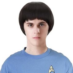 a young man wearing a star trek t - shirt