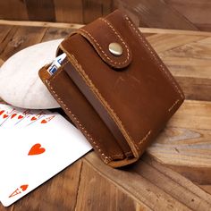 This gorgeous travel case is the perfect way to carry  your cards in style. This Genuine leather case can contains two decks playing cards.  Ideal for compact storage both at home or on the road, this durable cowhide leather holster will ensure that your favorite decks are kept in pristine condition wherever you go.  Built to last a lifetime, after time and use, the leather will attain a beautiful and unique patina that will show age and grace. This playing cards case can be engraved making this Rfid Blocking Rectangular Trifold Wallet, Rectangular Cases With Card Slots For Personal Use, Rectangular Wallets With Card Slots, Classic Rectangular Trifold Wallet For Travel, Classic Rectangular Trifold Travel Wallet, Brown Travel Coin Purse With Card Slots, Vintage Brown Card Holder For Travel, Vintage Rectangular Card Holder With Card Slots, Travel Cases With Card Slots