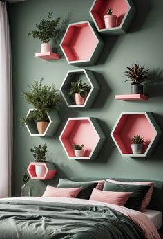 a bedroom with hexagonal shelves on the wall and potted plants in them