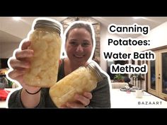 a woman holding two jars filled with water bath