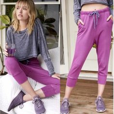 Lounge Around Or Work Up A Sweat In These Low-Rise Retro Style Joggers Featured In A Cropped Silhouette With A Drawstring Waistband And Slouchy Fit. Pull-On Style Adjustable Drawstring Waistband Ribbed Cuffs For A Fitted Ankle Dropped Inseam Color: Fuchsia New Without Tags, Label Marked To Prevent Store Returns Purple Sweatpants With Elastic Waistband, Purple Athleisure Bottoms For Loungewear, Stretch Yoga Pants For Leisure, Relaxed Fit Joggers For Yoga, Casual High Waist Purple Yoga Pants, Casual High-waisted Purple Yoga Pants, Spring Loungewear Yoga Pants With Pockets, Casual Purple Activewear With Pockets, Casual Purple High Waist Activewear