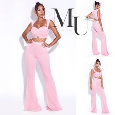 a woman in pink pants and crop top posing for the camera