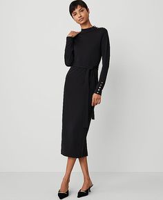 The quintessential style that pulls it all together, our belted column knit midi dress is enhanced with polished button detail. Mock neck. Long sleeves with button cuffs. Self tie belt. Shoulder button placket.,Hit:31 1/2" from natural waist,Imported:Imported,Fit:Hits at mid-calf,Length:31 1/2" from natural waist,Fabrication:Shell: 65% Modal, 28% Viscose, 7% Spandex; Lining: 65% Modal, 28% Viscose, 7% Spandex,Garment Care:Machine Washable Mock Neck Belted Column Knit Midi Dress by Ann Taylor Siz Business Casual Midi Dress, Black Work Dress, Kris Jenner Style, Black Work Dresses, List Inspiration, Formal Wear Women, Work Fits, Velvet Midi Dress, Black Knit Dress