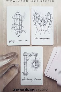 four cards with hand drawn designs on them and the words moondust studio written in cursive ink