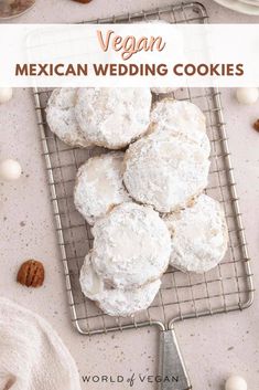 mexican wedding cookies on a cooling rack with the words vegan written above it and nuts scattered around