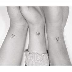 two women with matching tattoos on their arms