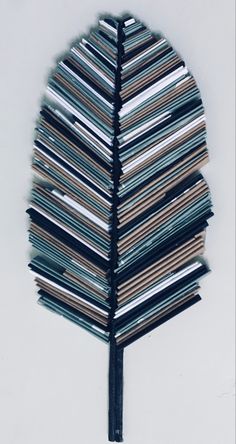 a tree made out of magazines sitting on top of a table