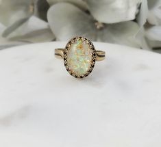 "This popular mosaic shell ring is made with an oval 10x14mm mosaic shell resin cabochon (in your choice of light cabochon or dark cabochon_, which we set in a lovely antiqued bronze crown ring bezel. This adjustable ring will fit just about any finger and makes a great beachcomber jewelry gift for her. Thank you for looking. NOTE: The 6th photo is a picture of the back of a similar ring, just so you can see how this ring can easily be sized to fit just about any ladies ring size. - Shop Gemsicl Beach Bridesmaids Gifts, Beach Bridesmaid, Seashell Ring, Mosaic Ring, Beach Bridesmaids, Resin Cabochon, Ring Bezel, Shell Ring, Bronze Ring