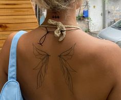 a woman with a tattoo on her back