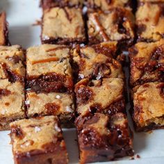 brownies cut into squares sitting on top of a table