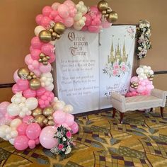 balloons and flowers decorate the entrance to a princess themed party