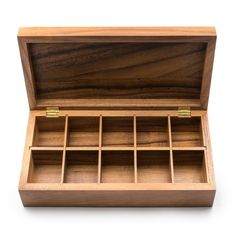 an open wooden box with compartments on the inside