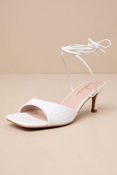 Instantly elevate any ensemble the moment you step into the Lulus Liddell White Textured Lace-Up High Heel Sandals! These stunning heels are composed of textured, embossed faux leather that shapes a square footbed and a wide, tapered toe strap. Slender straps sprout from the sides to wrap and tie above the ankle, all atop a sleek stiletto-style heel. 2. 75" wrapped stiletto heel. Lightly cushioned insole. Rubber sole has nonskid markings. Man made materials. Imported. Lulus | Liddell White Textu Elegant White Lace-up Sandals For Formal Occasions, Elegant White Lace-up Sandals For Formal Events, White Lace-up Sandals With Heel Strap For Formal Occasions, White Lace-up Sandals With Heel Strap For Formal Events, White Formal Lace-up Sandals With Open Heel, Stunning Heels, Lace Up High Heels, Sandal Heels, Size 11 Heels