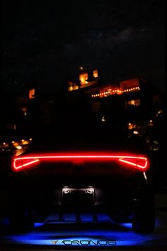 the back end of a car with its lights on