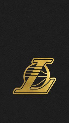 the golden letter z on black leather with gold trim and a basketball ball in it