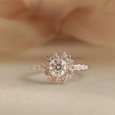 Blooming Flower Engagement Ring, Pink Sapphire Promise Rings, Sunflower Halo Diamond Ring, Art Deco Daisy Ring, Custom Birthstone Rings We use the highest quality moissanite! Moissanite: ✦ Color: D Colorless ✦ Clarity: VVS1 OR All our diamonds are 100% natural. We use only conflict-free diamonds and gemstones. Diamond: ✦ Color: F-G ✦ Clarity: SI1-VS ✦PRODUCT DETAILS✦ → center stone: moissanite; 0.50ct → accent stone: moissanite; natural pink sapphire Also available in other colored gemstones upo Engagement Ring Pink, Sapphire Promise Rings, Pink Diamonds Engagement, Heart Shaped Diamond Ring, Pink Engagement, Custom Birthstone Ring, Pink Diamond Engagement Ring, Argyle Pink Diamonds, Flower Engagement